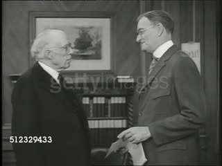 1917  DRAMATIZATION: Elder males in office of middle-aged male. MS Liberty Bond poster. Elder male (preacher) asking to be put to work. MS Liberty Bond poster, 'Beat Back the Hun w/ Liberty Bonds'